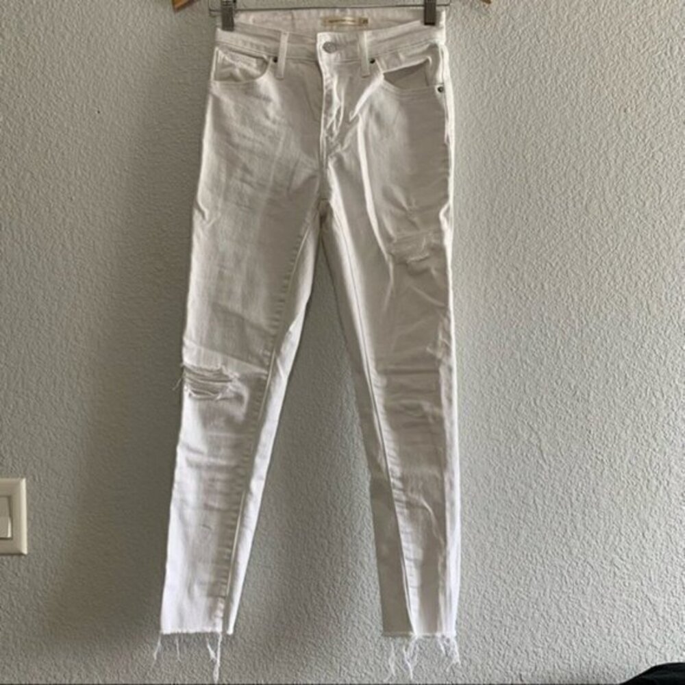 Levi’s 721 High Rise Raw Hem Distressed Skinny Jeans